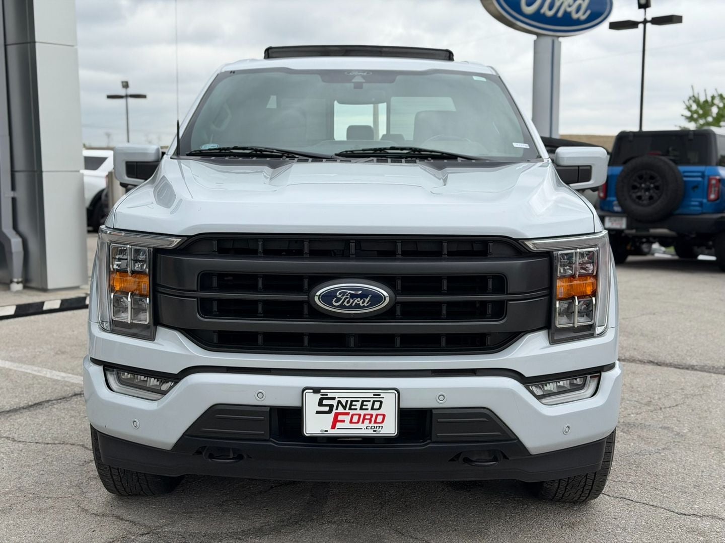 Used 2021 Ford F-150 Lariat with VIN 1FTFW1E87MKE99290 for sale in Kansas City